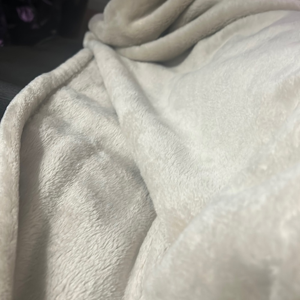 A warm soft, throw tope color, twin size